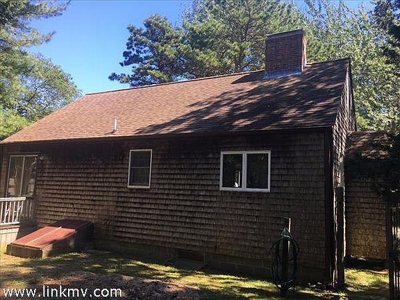 Back exterior with large fenced in yard