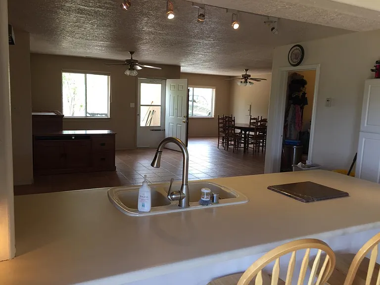 Kitchen into Entry Dining Room/Den