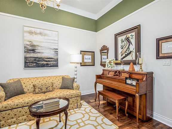 Study with Engineered hardwood floors and crown molding.