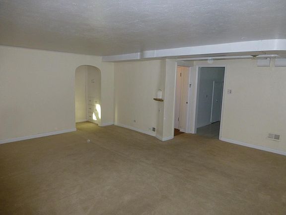 Looking towards entry door with the kitchen on the right.