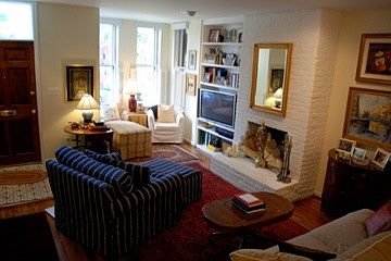 light-filled living room with fireplace and built-ins