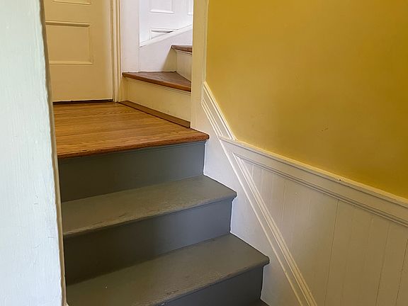 Stairs off side door up to 2nd floor