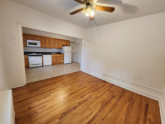Spacious living room looking towards the eat-in kitchen.