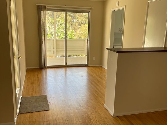 View from living room to dining area to patio