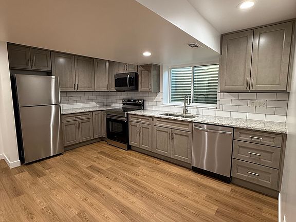 Kitchen with brand new appliances, cabinetry and quartz countertops