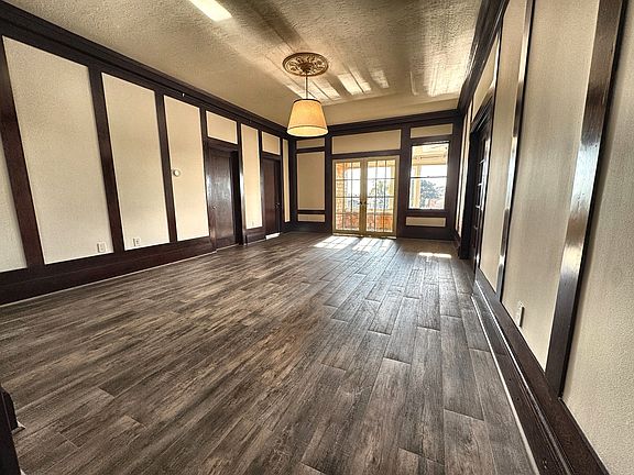 Living room from the inglenook. The primary bedroom is the brown door at left corner, the next door is the middle bedroom.
