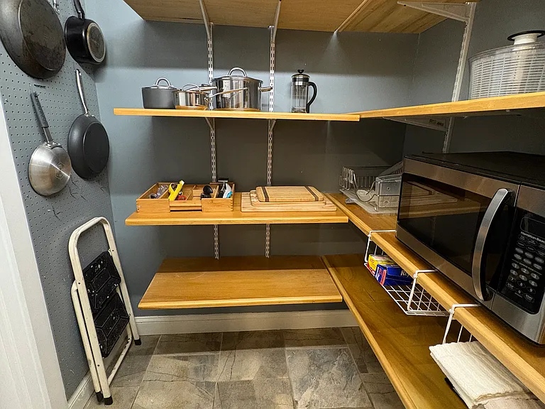 Walk-in pantry off the kitchen offers lots of storage