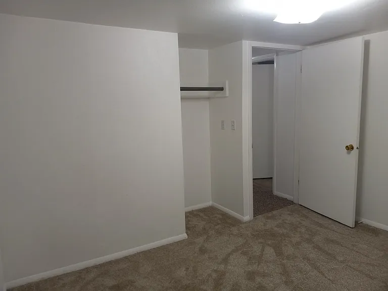 View # 2 of second bedroom. Shows entrance & single closet