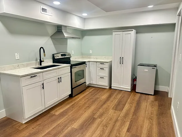 Completed renovated basement with full kitchen.