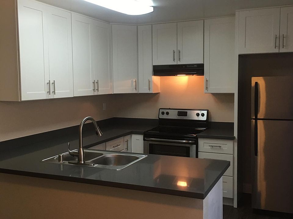 updated kitchen with stainless appliances and quartz counter