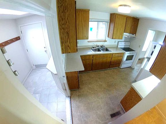 Mudroom with skylight and kitchen with dishwasher
