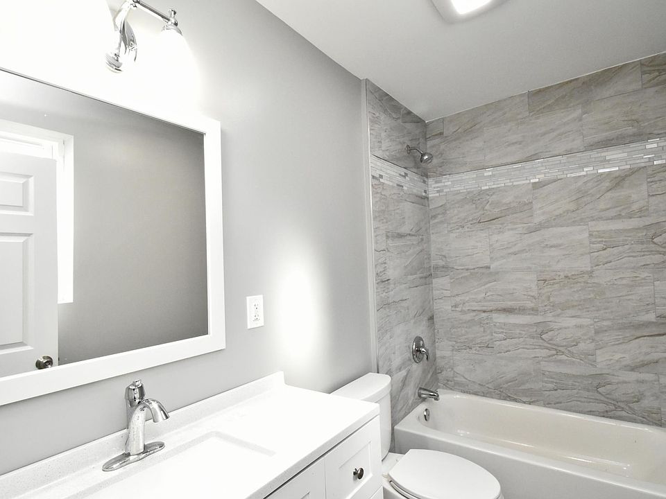 Brand new bathroom featuring a tiled shower