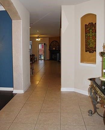 Entry view from front porch. Formal dining to the left and niche to the right.