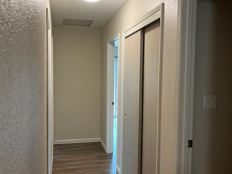 Hallway with large closet