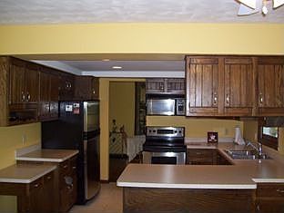 Kitchen with newer stainless steel appliances.