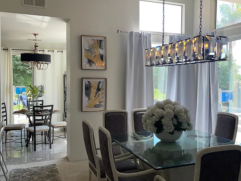 View off dining area leading to kitchen and breakfast nook.