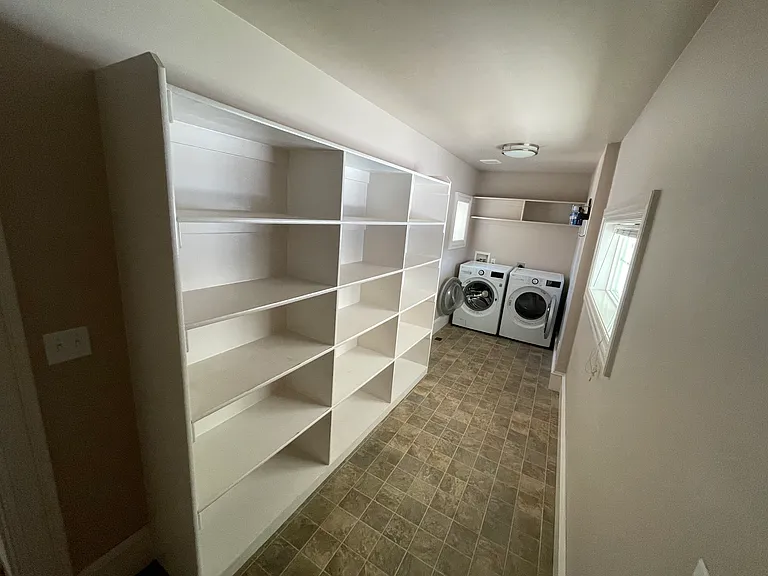 Laundry/mudroom is right off the back entrance, includes newer front loading washer/dryer