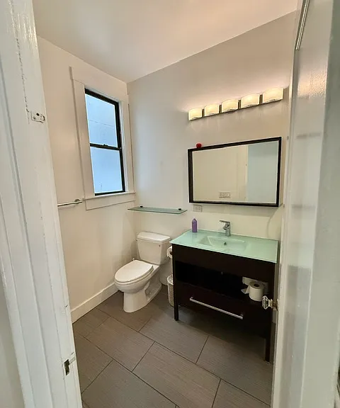 Full bathroom with tub over shower