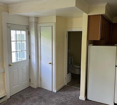 Living room looking towards door and bathroom