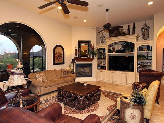 As you get further into the living area, notice the arches in the cabinetry and the window and the o