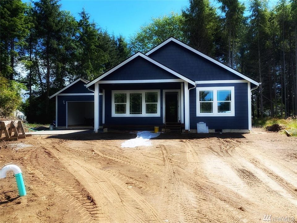 Photo of builder's previous build and not exact of home under construction.