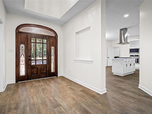 Entrance foyer with dark wood-type flooring