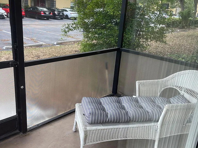 screened in patio now has table and chairs and this lounger