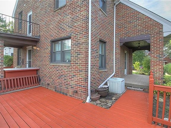 The rear deck connects the back porch and side patio for continuous flow of the outdoor space.