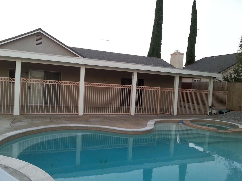 Backyard pool wih Jacuzzi, safety fence for children