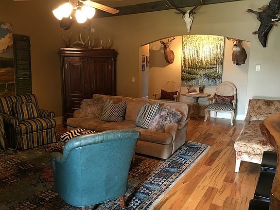 Living Room
						:
						Custom stacked slate FP surround, mantle, bar top, beams, vaulted ceiling