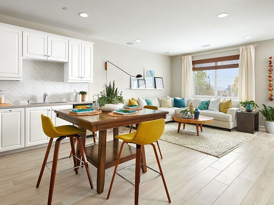 Dining table in Kitchen with view of living room in Residence 1 at Indigo at Canvas Park