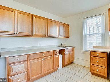 The apartment has a huge kitchen, with ceramic tile floors, perfect for someone who enjoys cooking.