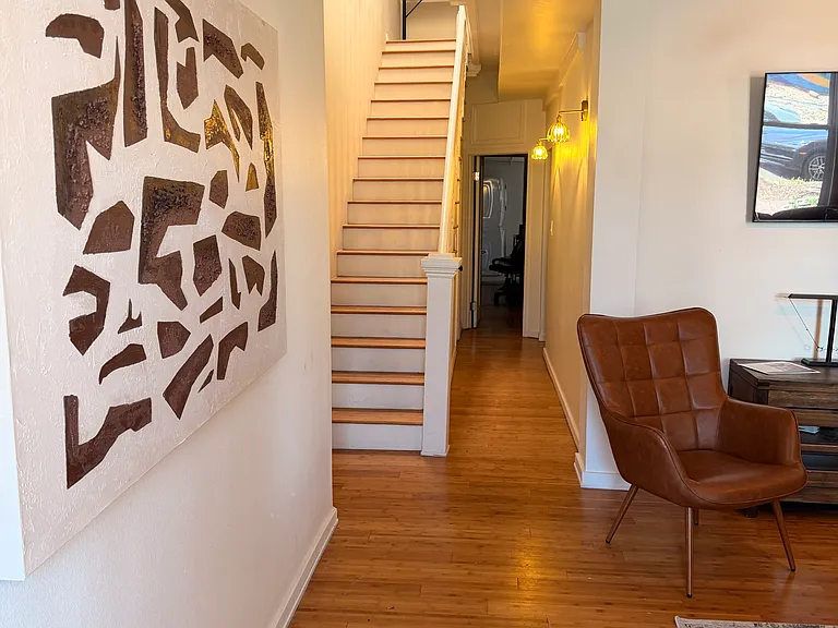 Stairs up to two more bedrooms and kitchen/dining area