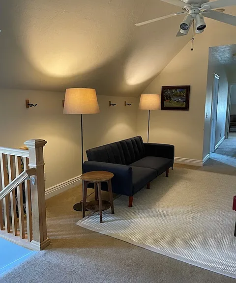 Front room with sleeper couch that lays flat to create a double bed.
