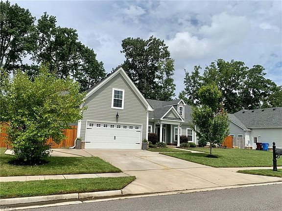 Double Car driveway and garage with extra driveway pad for parking your RV or boat!
