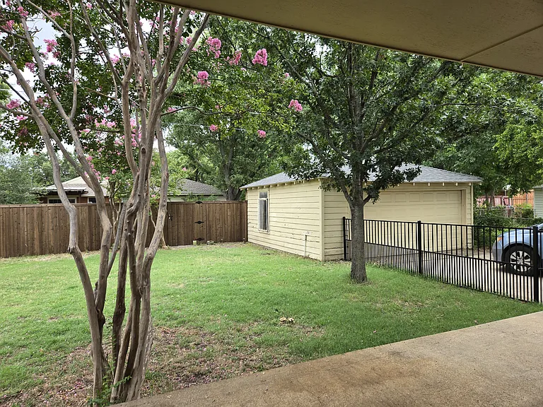 Photo of the backyard with our garage in the background. (Yes, it is detatched.:)