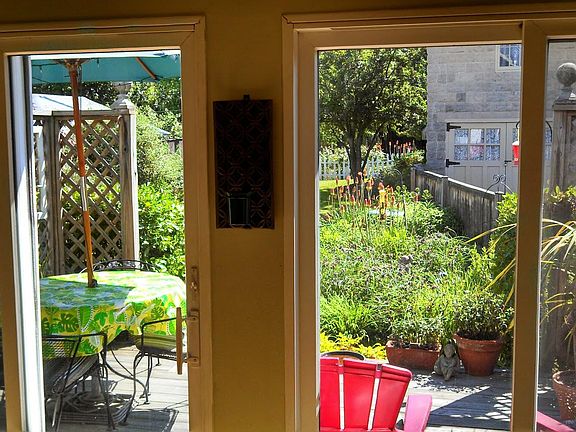 Sunroom looking on to deck and yard