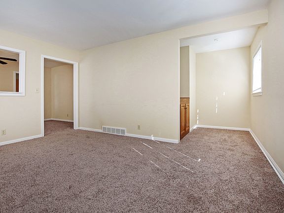 Corner of family room looking at reading nook and dining room.
