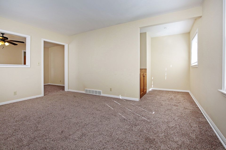Corner of family room looking at reading nook and dining room.