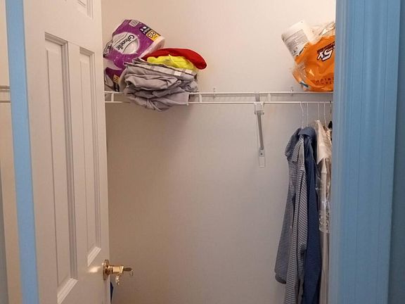 Walk in big closet in bedroom
