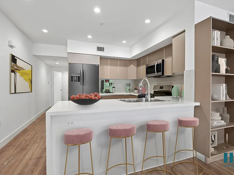 Open-Concept Kitchen with a Countertop Bar and Built-In Shelving