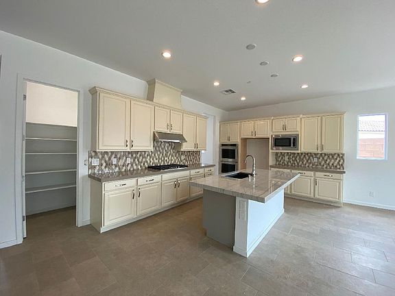 Designer kitchen features KitchenAid appliances with double oven