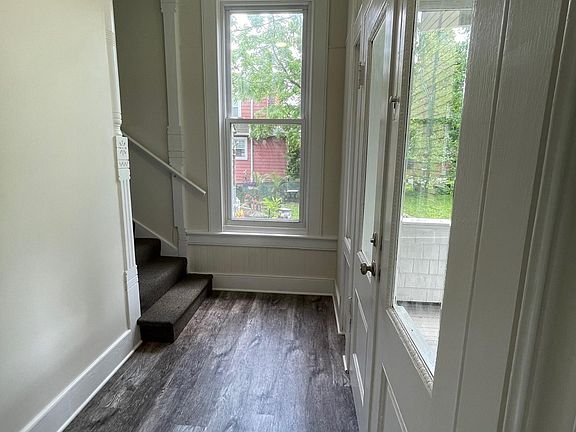 Foyer and stairs leading to unit