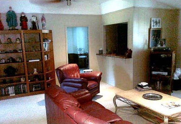 Huge living area overlooks backyard.