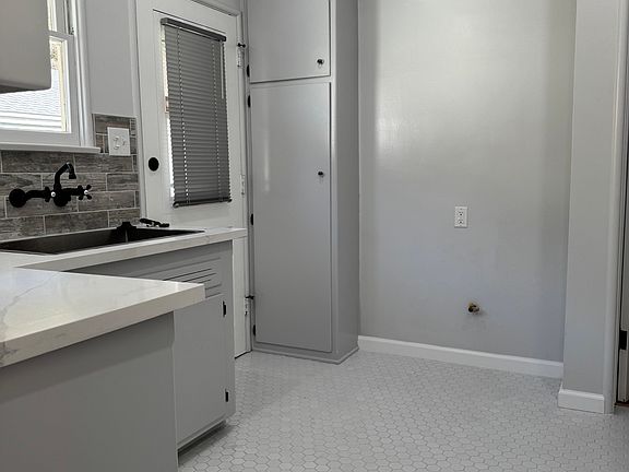 This unit has a backdoor entrance leading down to the garage