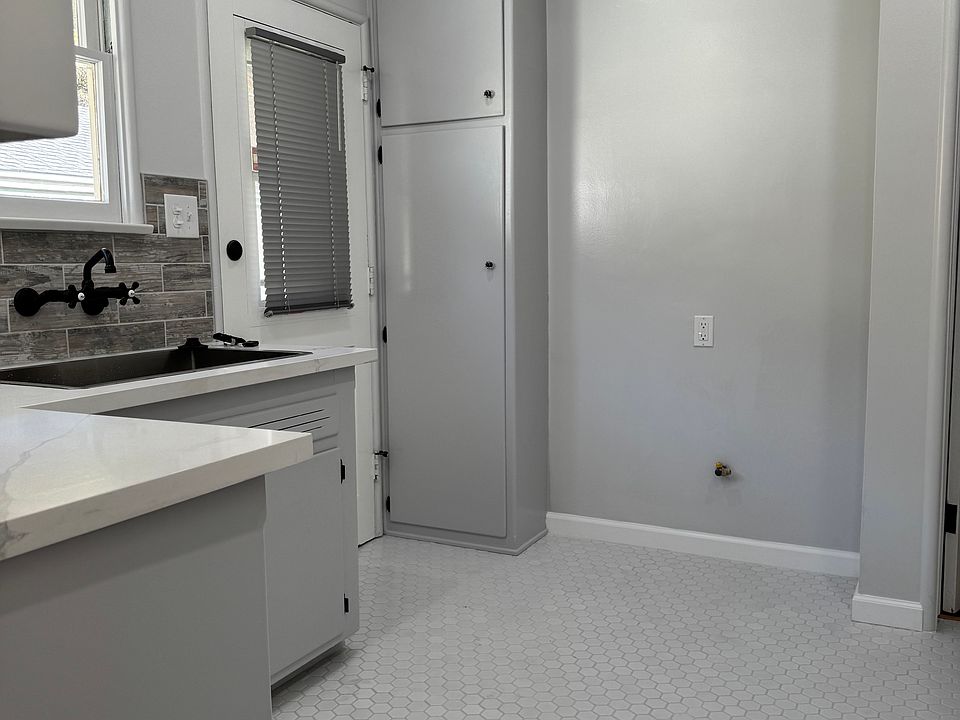 This unit has a backdoor entrance leading down to the garage