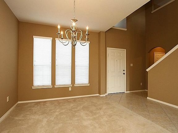 AS YOU ENTER THE HOME THE FORMAL DINING ROOM IS TO THE RIGHT.