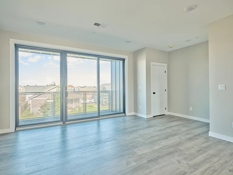 Main living level on 2nd floor with 12'wide x 8' tall Andersen sliding glass door opening to large covered patio