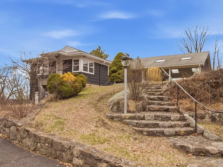 Tucked at the end of a quiet cul-de-sac, this exceptional estate offers rare privacy on more than 3 picturesque acres.