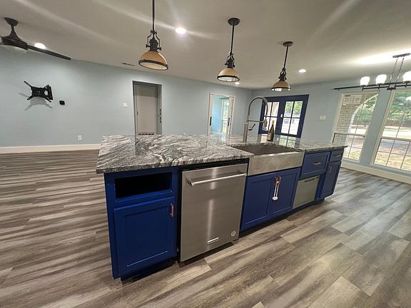 apron sink with 2 dishwashers with cabinet space for vegetables included.